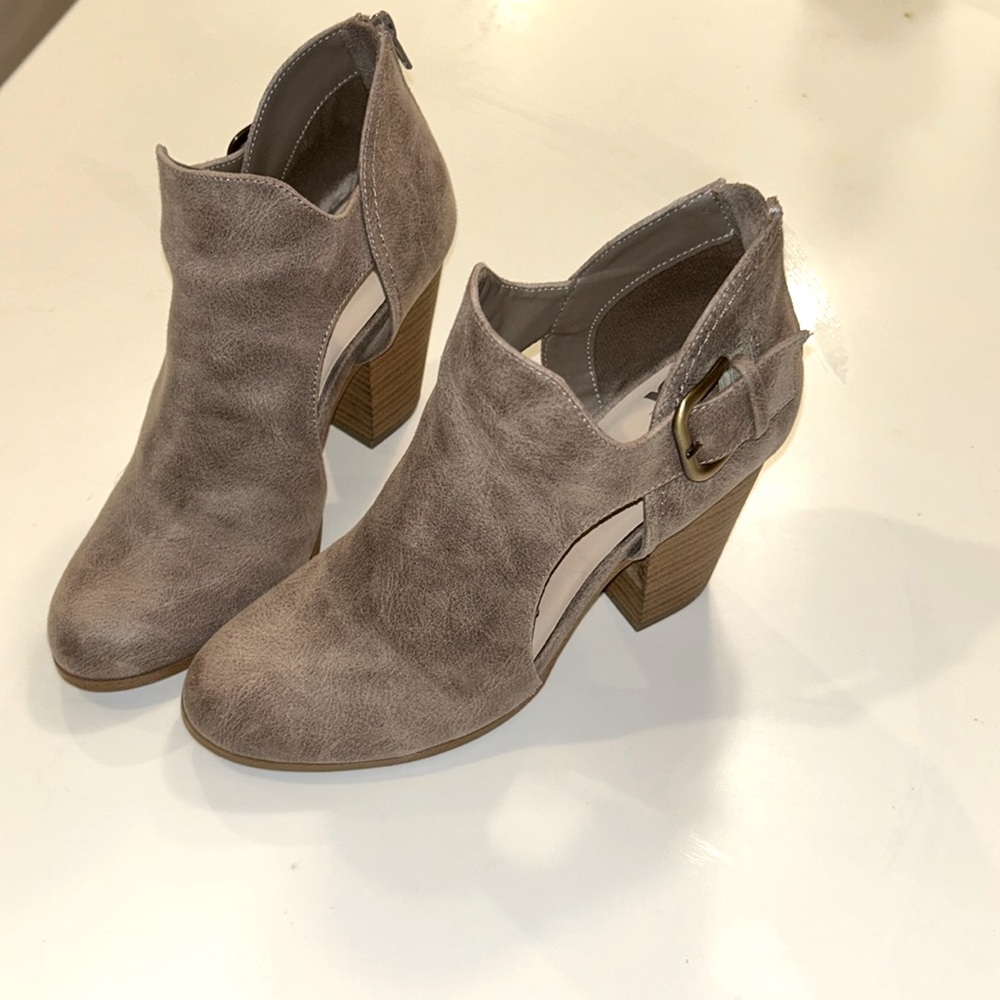 Fergie boots. Back zip. Cut out design. Size 8. Like new.